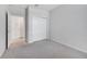 Neutral bedroom with carpet, closet, and a neutral gray paint at 2578 Cliff Way, St Cloud, FL 34771