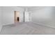 Empty bedroom features neutral carpet and two entry doors at 2578 Cliff Way, St Cloud, FL 34771
