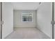 Minimalist bedroom with light carpet, white walls, a window with blinds, and a simple and airy feel at 2578 Cliff Way, St Cloud, FL 34771