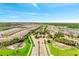 Aerial view of the Del Webb Sunbridge community featuring lush landscaping, water features, and stunning architecture at 2578 Cliff Way, St Cloud, FL 34771