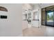 Hallway with view of craft room featuring glass doors and signage, offering a designated space for creative activities at 2578 Cliff Way, St Cloud, FL 34771