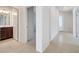Bright hallway leading to bathroom with tile floors, with a bedroom on the left at 2578 Cliff Way, St Cloud, FL 34771