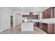 Open kitchen design with stainless steel appliances, white countertops, and a breakfast bar at 2578 Cliff Way, St Cloud, FL 34771