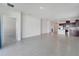 Spacious living area with tile flooring adjacent to the kitchen in this home at 2578 Cliff Way, St Cloud, FL 34771