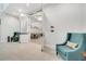 Inviting lounge area with comfortable armchairs, open doorway to dining area, and stylish interior design at 2578 Cliff Way, St Cloud, FL 34771