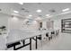 Bright meeting room with long table, white chairs, and a mounted television, suitable for business meetings and presentations at 2578 Cliff Way, St Cloud, FL 34771
