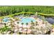 Breathtaking resort-style pool surrounded by lush landscaping and serene lake views at 2578 Cliff Way, St Cloud, FL 34771