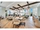 Elegant restaurant with wood beam accents, stylish light fixtures, and ample seating for diners at 2578 Cliff Way, St Cloud, FL 34771