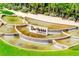 Del Webb Sunbridge community entrance sign surrounded by an elegant tiered water feature and lush greenery at 2578 Cliff Way, St Cloud, FL 34771