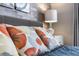 Bedroom featuring floral accent pillows and decor on the bed at 2630 Sunrise Shores Dr, Kissimmee, FL 34747