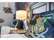 Cozy bedroom featuring black bed frames, decorative pillows, and Harry Potter themed decor at 2630 Sunrise Shores Dr, Kissimmee, FL 34747