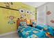 Bedroom with Minions themed decor and twin beds at 2630 Sunrise Shores Dr, Kissimmee, FL 34747
