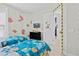A Minion themed bedroom with twin beds, tv and brick decals on the wall at 2630 Sunrise Shores Dr, Kissimmee, FL 34747