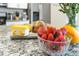 Bright kitchen featuring granite countertops, stainless steel appliances, and fruit on the counter at 2630 Sunrise Shores Dr, Kissimmee, FL 34747