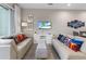 Bright living room features comfortable seating, stylish decor, and a modern entertainment center at 2630 Sunrise Shores Dr, Kissimmee, FL 34747