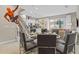 Open-concept living space featuring a dining area, staircase, and modern kitchen at 2630 Sunrise Shores Dr, Kissimmee, FL 34747
