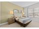 Well-furnished main bedroom with mirrors, queen bed, and a nightstand on each side at 2630 Sunrise Shores Dr, Kissimmee, FL 34747