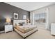 Comfortable bedroom with carpet floor, king bed, a window and bedside lamps at 2630 Sunrise Shores Dr, Kissimmee, FL 34747