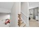 Staircase featuring brick accent wall and whimsical cartoon art at 2630 Sunrise Shores Dr, Kissimmee, FL 34747