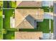 Aerial shot of a well-maintained home featuring a manicured lawn and large concrete patio at 2657 Bullion Loop, Sanford, FL 32771