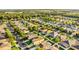 Overhead view of a residential neighborhood featuring tree-lined streets and well-maintained homes at 2657 Bullion Loop, Sanford, FL 32771