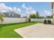Spacious backyard featuring lush grass, a privacy fence, and a storage shed at 2657 Bullion Loop, Sanford, FL 32771