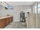 Bathroom featuring a double sink vanity, gray flooring, and a glass-enclosed shower at 2657 Bullion Loop, Sanford, FL 32771