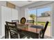 Dining area featuring a wooden table, matching chairs, and sliding glass doors that lead to the yard at 2657 Bullion Loop, Sanford, FL 32771