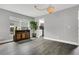 Dining room featuring wood floors, a modern bar cabinet, and ample natural light at 2657 Bullion Loop, Sanford, FL 32771