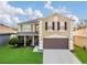 Charming two-story home featuring a well-manicured lawn and attached two car garage at 2657 Bullion Loop, Sanford, FL 32771