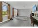 Bright living room with two large windows and gray flooring at 2657 Bullion Loop, Sanford, FL 32771