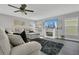 Comfortable living room featuring a modern fireplace, contemporary furnishings, and ample natural light at 2657 Bullion Loop, Sanford, FL 32771