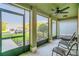 Relaxing screened-in patio with comfortable seating, perfect for enjoying the outdoors in any weather at 2657 Bullion Loop, Sanford, FL 32771