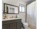 Bathroom with a gray vanity, subway tile backsplash, large mirror, and shower/tub combo at 2809 Redditt Rd, Orlando, FL 32822