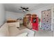 Spacious bedroom with plenty of storage featuring carpeted floors and a ceiling fan at 2809 Redditt Rd, Orlando, FL 32822