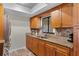 Stylish kitchen featuring granite countertops, stainless steel appliances, and wood cabinetry at 2809 Redditt Rd, Orlando, FL 32822