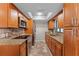Well-lit kitchen with stainless steel appliances, granite countertops, and ample cabinet space at 2809 Redditt Rd, Orlando, FL 32822