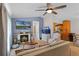 Comfortable living area featuring a fireplace, entertainment center, and an open layout at 2809 Redditt Rd, Orlando, FL 32822