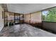 Enclosed patio featuring tiled floors, screened windows, and a sliding glass door at 2809 Redditt Rd, Orlando, FL 32822