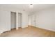 Bedroom with wood-look flooring and large closet at 2829 Lake Griffin Rd, Lady Lake, FL 32159