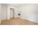 Bedroom with wood-look flooring and an open door to the house at 2829 Lake Griffin Rd, Lady Lake, FL 32159