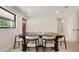 Bright dining room with natural light and paneled walls next to an adjacent room at 2829 Lake Griffin Rd, Lady Lake, FL 32159