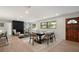 Open-concept living space featuring a fireplace, built-ins, and an elegant dining area for seamless entertaining at 2829 Lake Griffin Rd, Lady Lake, FL 32159