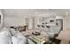 Bright, open-concept living space featuring a stylish living room, dining area, and a modern kitchen at 2829 Lake Griffin Rd, Lady Lake, FL 32159