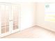 Bright bedroom featuring double doors and natural light at 313 Bass Ct, Kissimmee, FL 34759