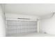 Clean, well-lit garage with a modern paneled door and ample space at 313 Bass Ct, Kissimmee, FL 34759