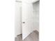 Walk-in pantry with white wire shelving and light gray wood flooring at 313 Bass Ct, Kissimmee, FL 34759