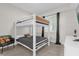 bedroom showcasing a white bunk bed with gray bedding and a comfortable side chair at 3180 Paradox Cir # 304, Kissimmee, FL 34746