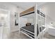 Bedroom with bunk beds, tiled floor, and a doorway leading to the bathroom at 3180 Paradox Cir # 304, Kissimmee, FL 34746