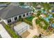 View of the clubhouse, basketball court, and pool in a planned community with manicured landscaping at 3180 Paradox Cir # 304, Kissimmee, FL 34746